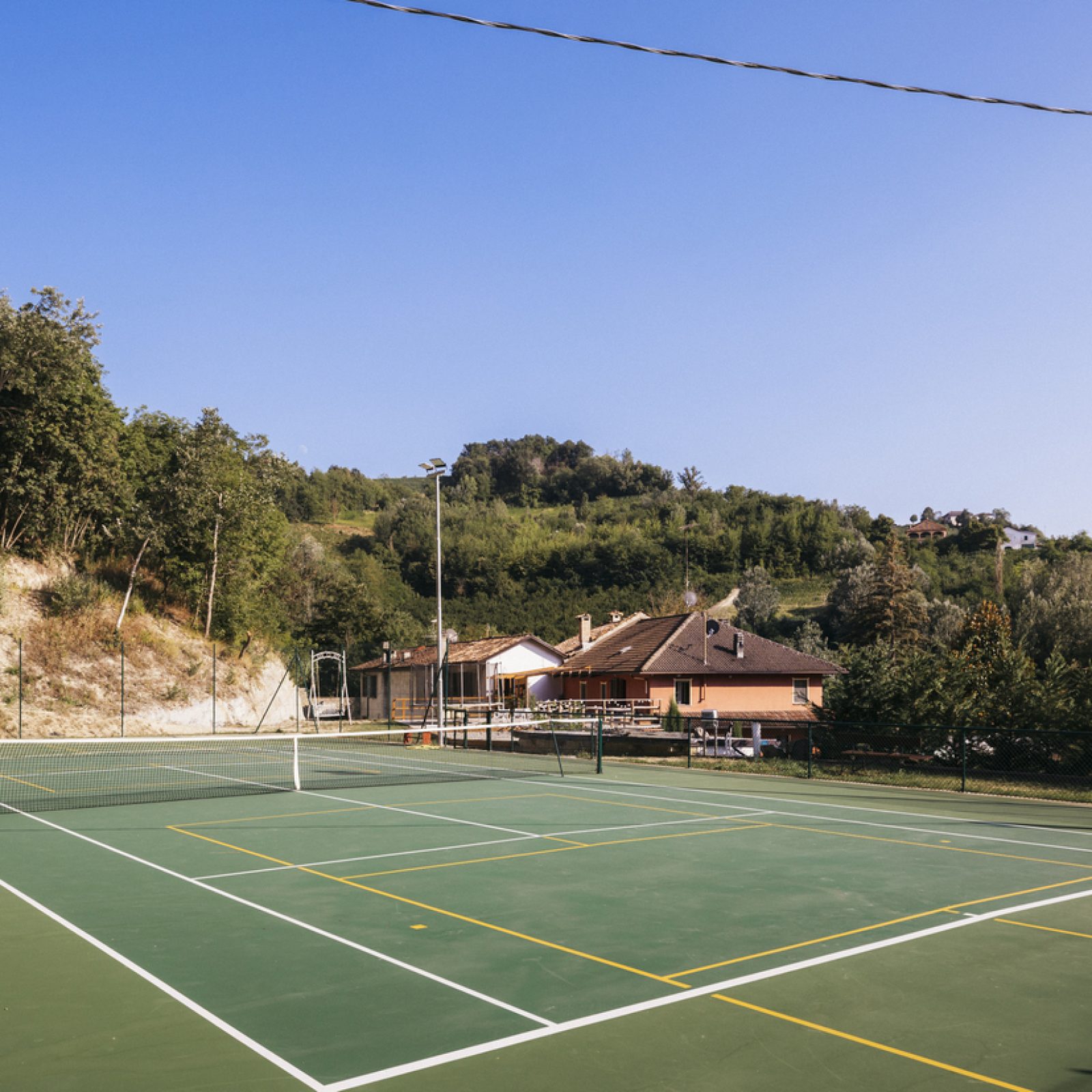 court from far side looking to house